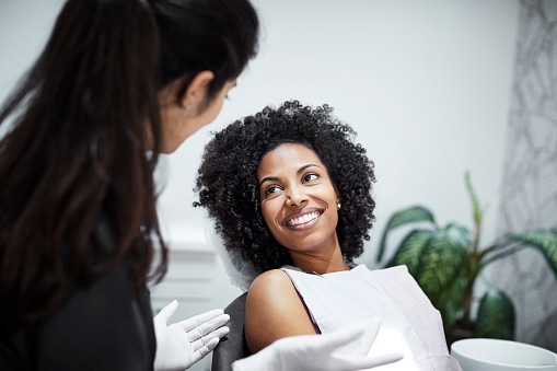 Image of a smiling woman at St. Louis Prosthodontics.