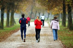 Image of trees and people in the Crestwood, MO area, near St. Louis Prosthodontics.